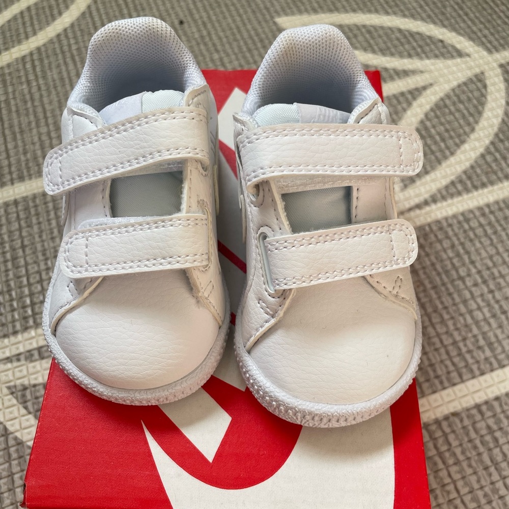 Infant white Nikes shoes